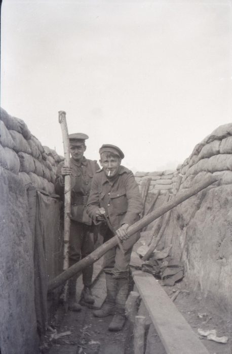 Photograph of two soliders in the trench doing “repairs” (NRO 06038/51)
